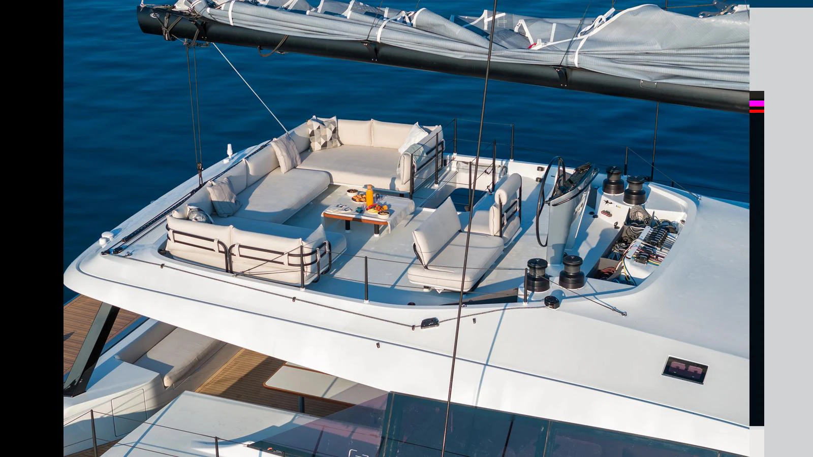 a white boat with a blue body aboard GUNBOAT 72 Yacht for Sale