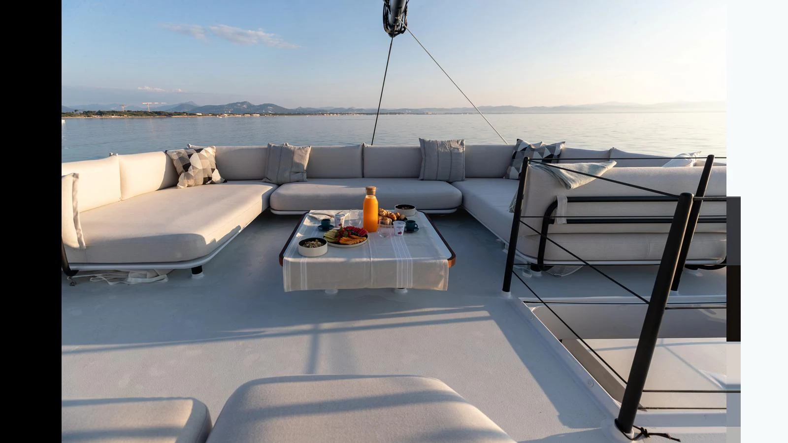 a living room with a couch and a table aboard GUNBOAT 72 Yacht for Sale