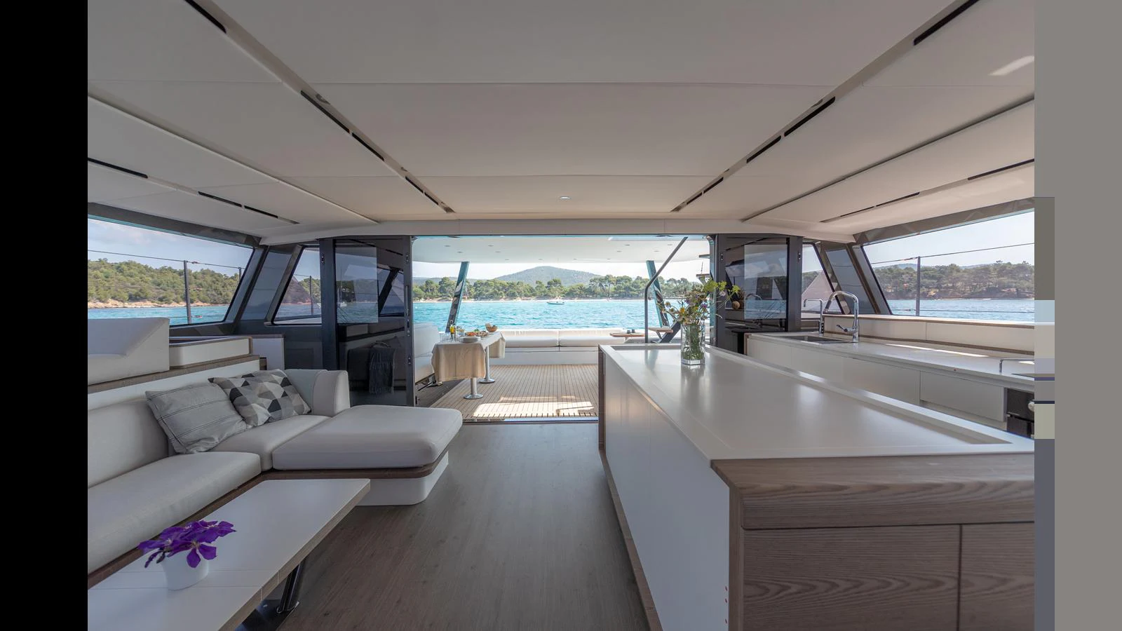 a room with a couch and a table aboard GUNBOAT 72 Yacht for Sale