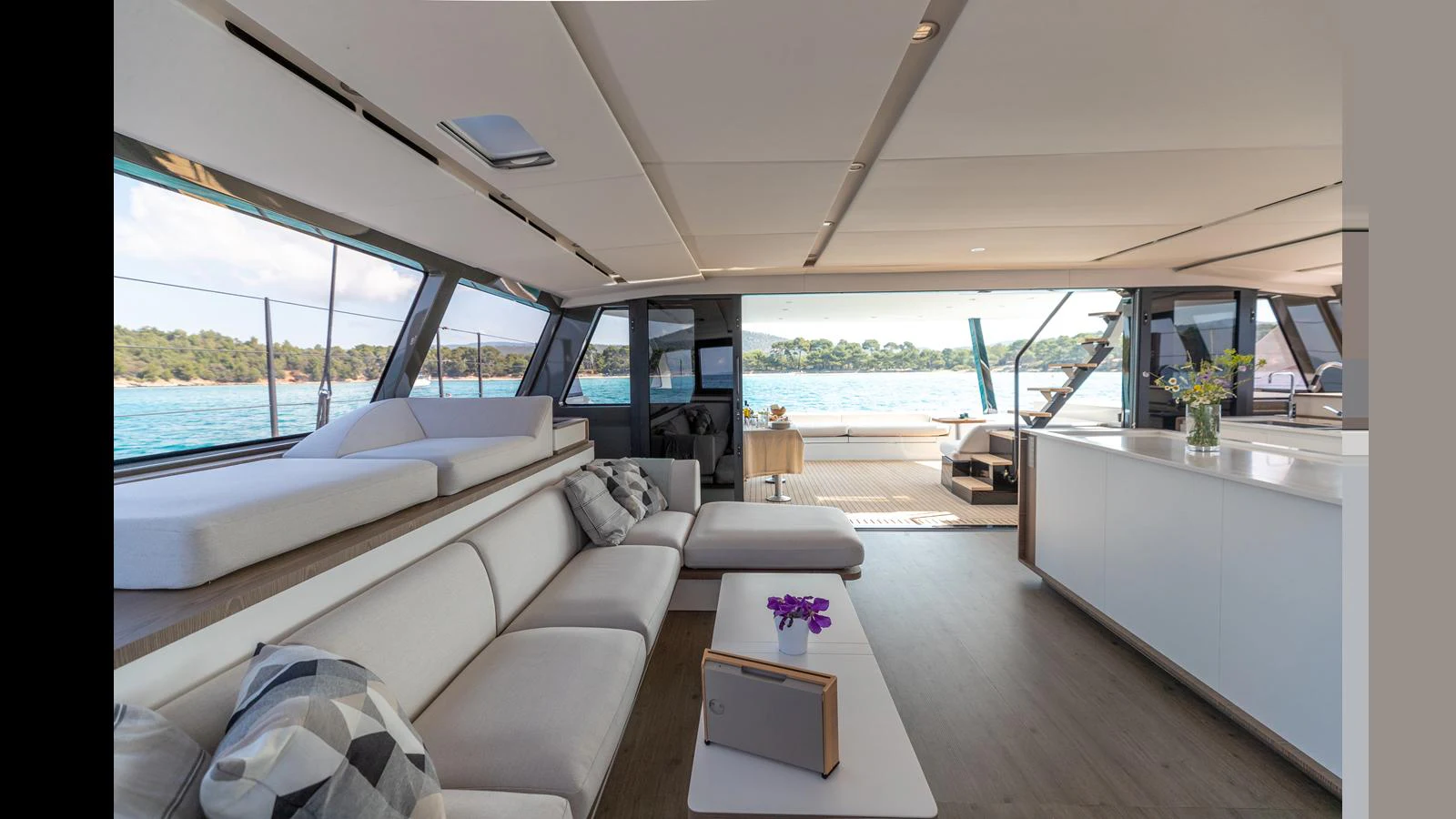 a room with a bed and a table aboard GUNBOAT 72 Yacht for Sale