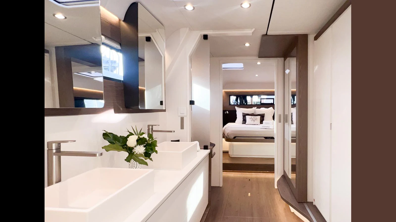 a bathroom with a large mirror aboard GUNBOAT 72 Yacht for Sale
