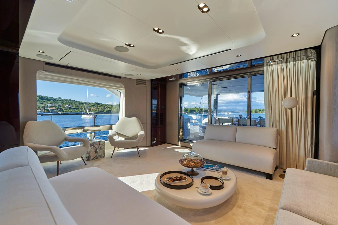a living room with a large window aboard ALUMINIA TOO Yacht for Sale