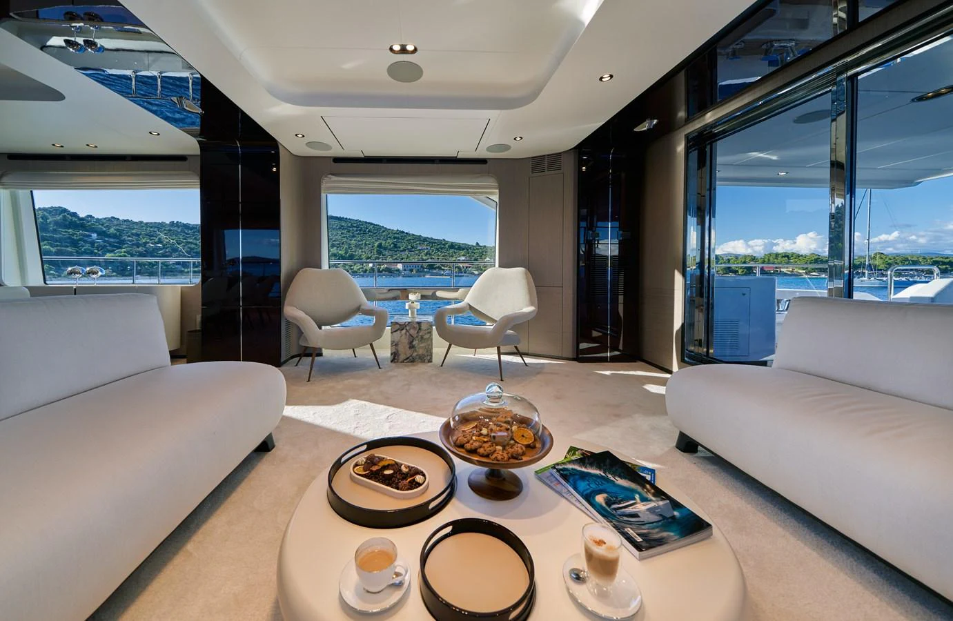 a living room with a large window aboard ALUMINIA TOO Yacht for Sale