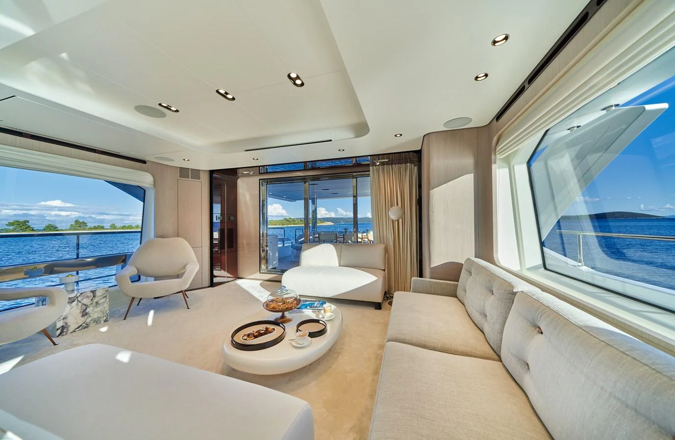 a living room with a large window aboard ALUMINIA TOO Yacht for Sale