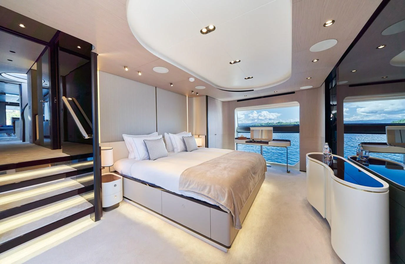 a room with a bed and a large mirror aboard ALUMINIA TOO Yacht for Sale