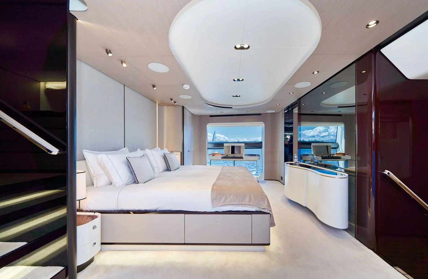 a room with a bed and a desk aboard ALUMINIA TOO Yacht for Sale