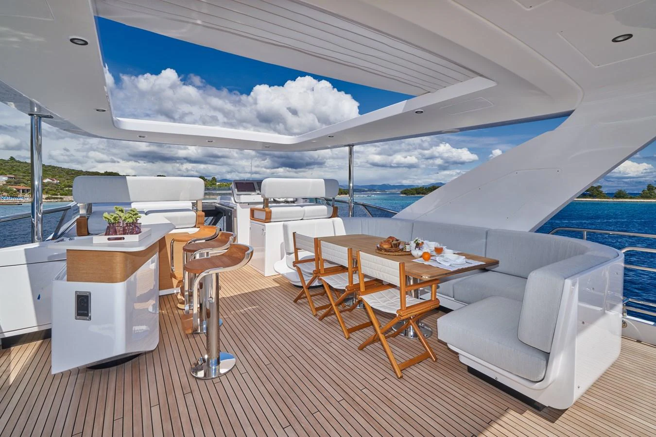 a room with a table and chairs aboard ALUMINIA TOO Yacht for Sale