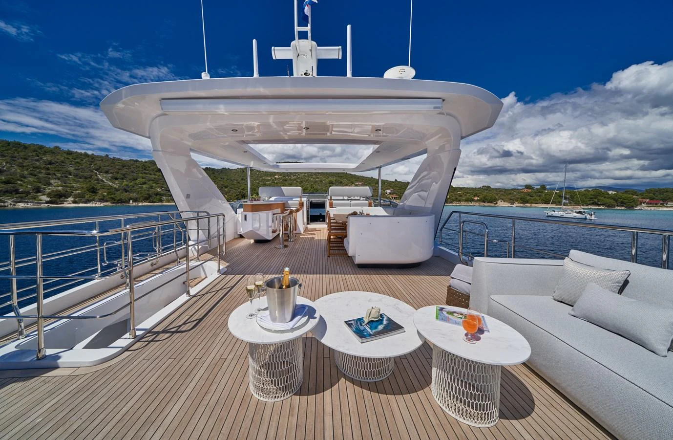 a large white ship on a deck aboard ALUMINIA TOO Yacht for Sale