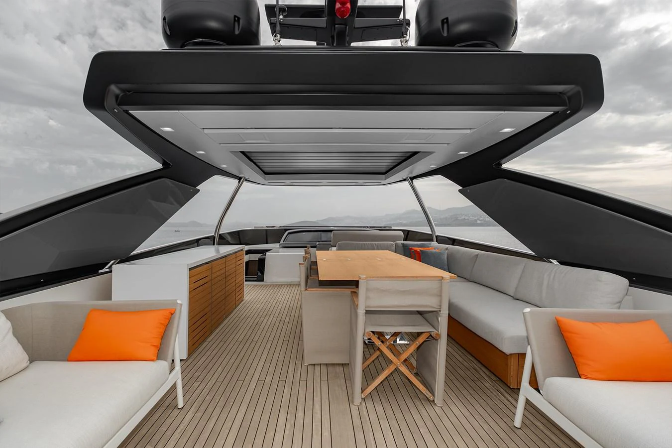a black and white boat on a wooden deck aboard JOURNEY Yacht for Sale