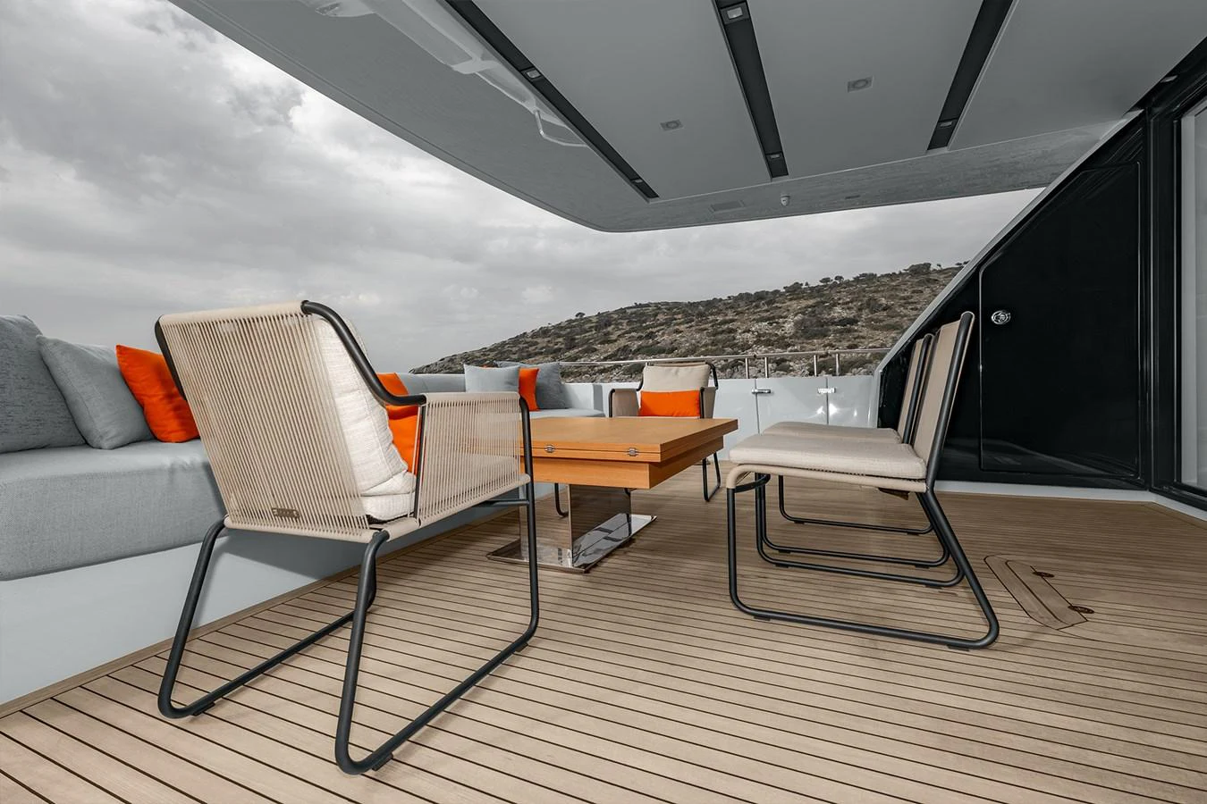 a room with a couch and a table and a large window aboard JOURNEY Yacht for Sale
