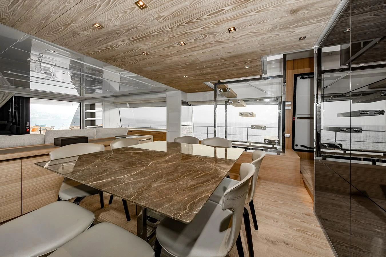 a room with a table and chairs aboard JOURNEY Yacht for Sale