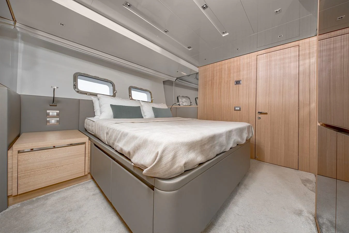 a room with a bed and a desk aboard JOURNEY Yacht for Sale