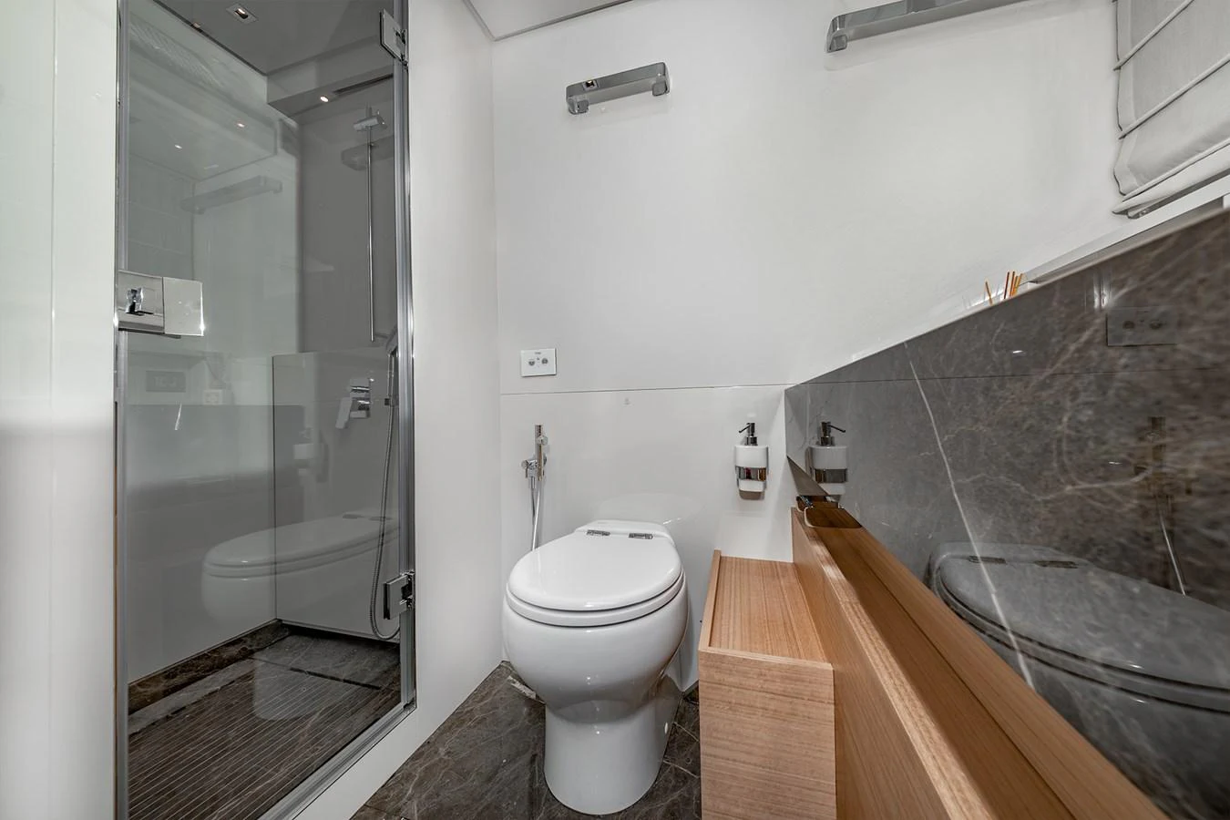 a bathroom with a glass shower aboard JOURNEY Yacht for Sale