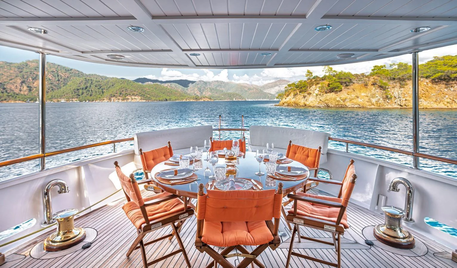 The aft deck offers a luxurious dining experience with stunning views of the surrounding waters and landscape. aboard LADY L Yacht for Sale