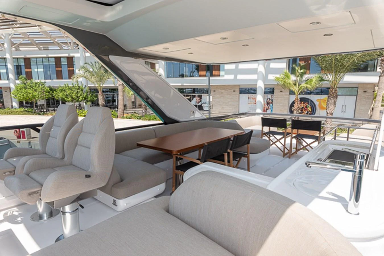 a room with a table chairs and a large window aboard PRINCEPESSA Yacht for Sale