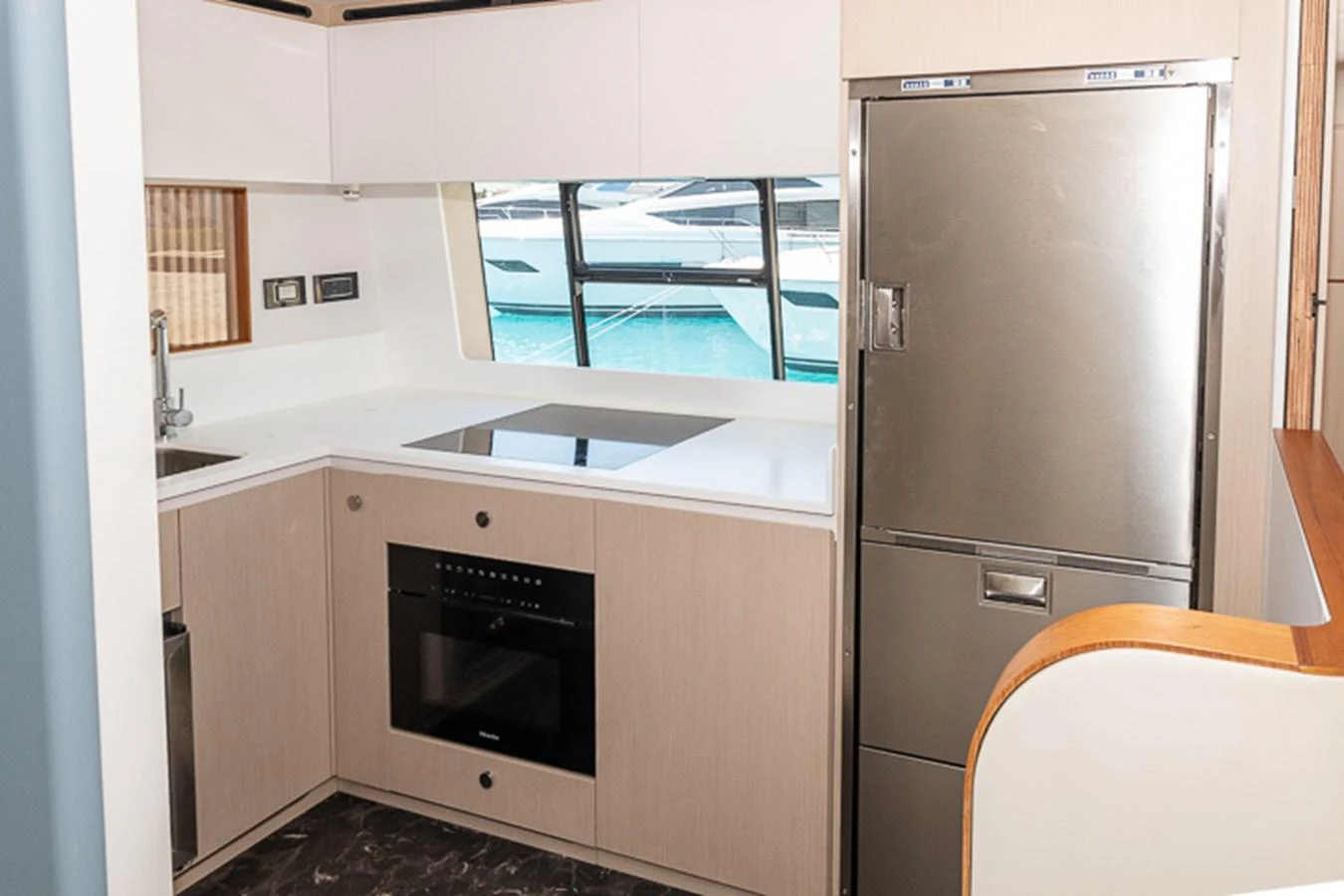 a kitchen with a refrigerator and a sink aboard PRINCEPESSA Yacht for Sale