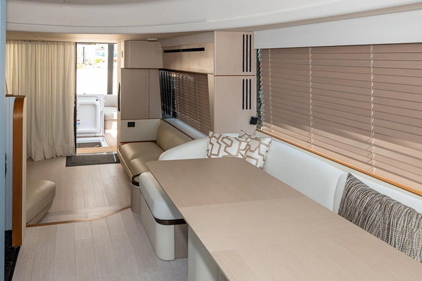 a large living room with a large table and chairs aboard PRINCEPESSA Yacht for Sale