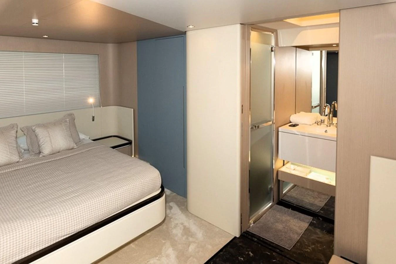 a bedroom with a bed and a mirror aboard PRINCEPESSA Yacht for Sale