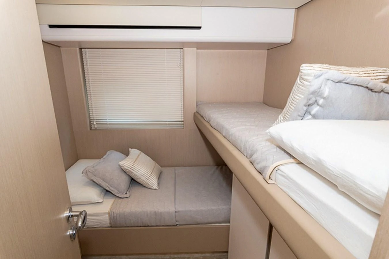 a bed with a white pillow aboard PRINCEPESSA Yacht for Sale