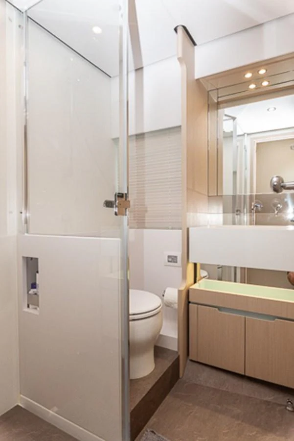 a bathroom with a toilet and a sink aboard PRINCEPESSA Yacht for Sale