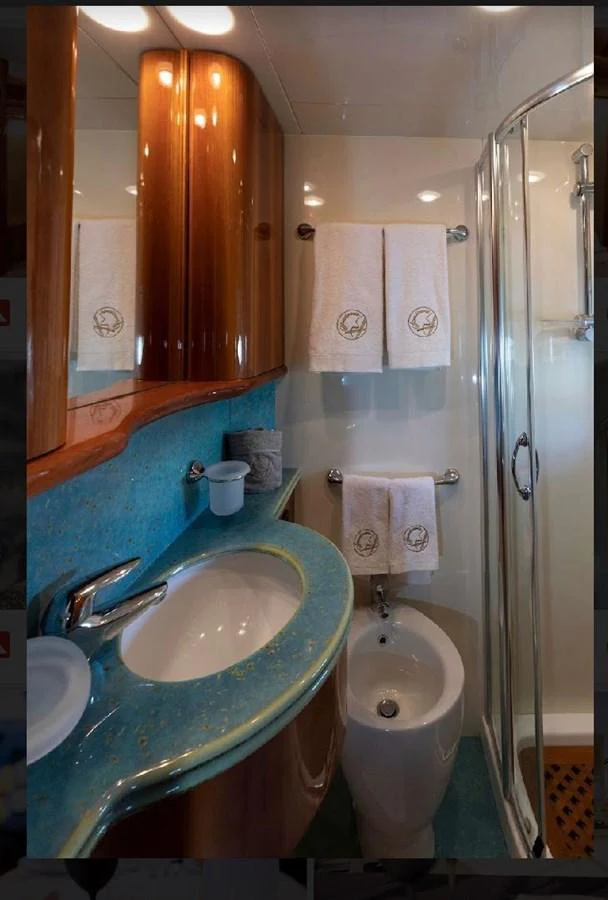 A luxurious yacht bathroom featuring elegant fixtures and plush towels. aboard STRADIVARIA Yacht for Sale