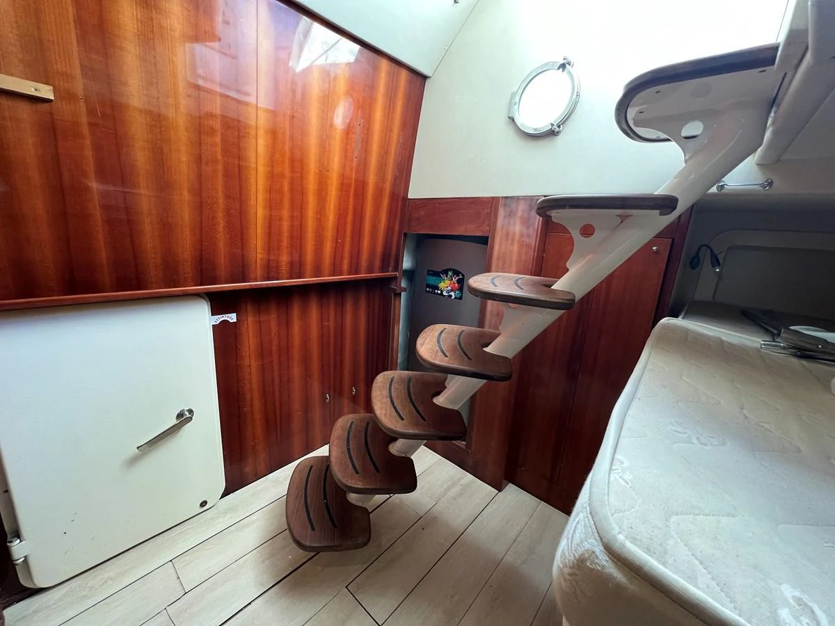 A cozy interior space featuring a wooden staircase and modern design elements. aboard STRADIVARIA Yacht for Sale