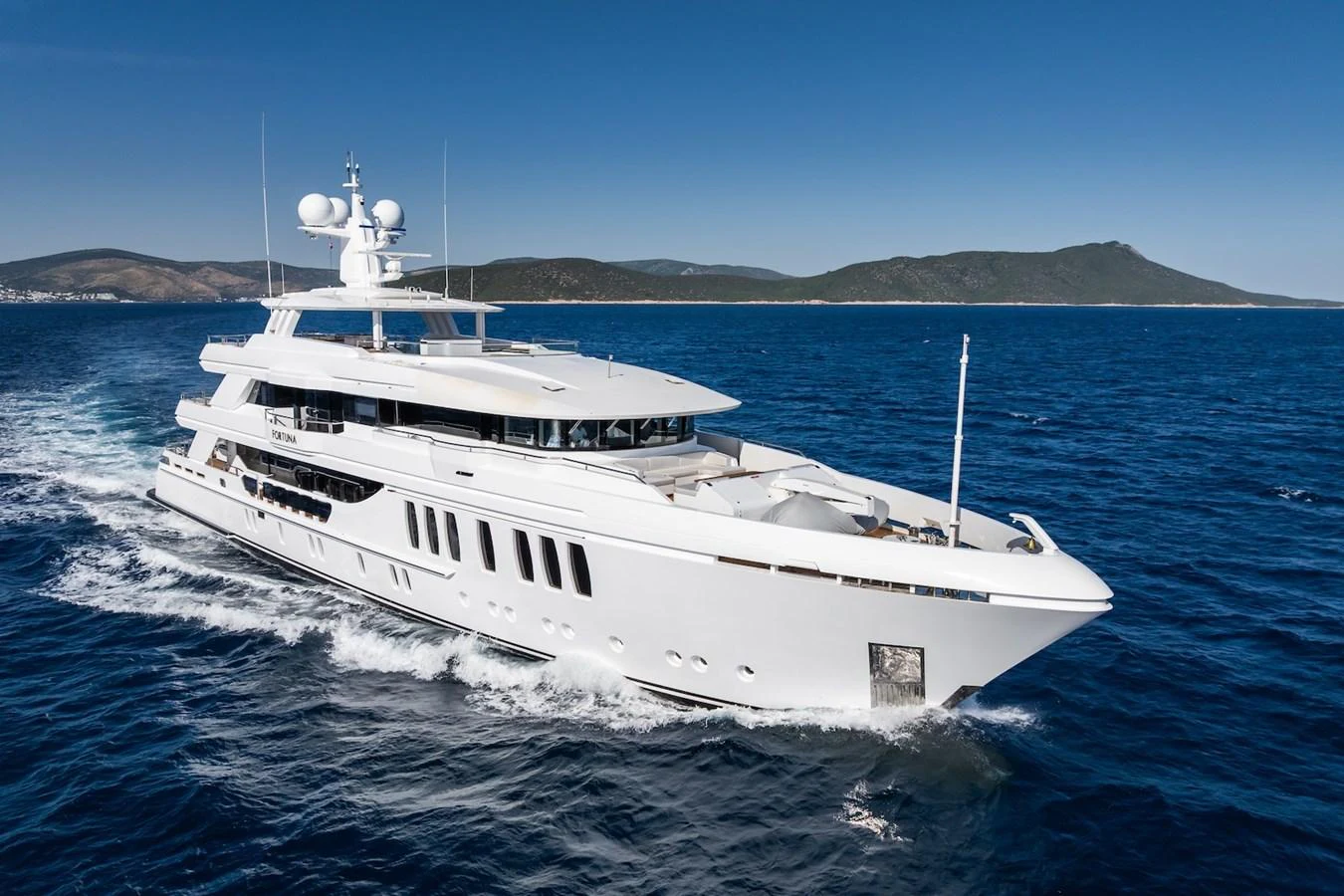 a white yacht in the water aboard FORTUNA Yacht for Sale