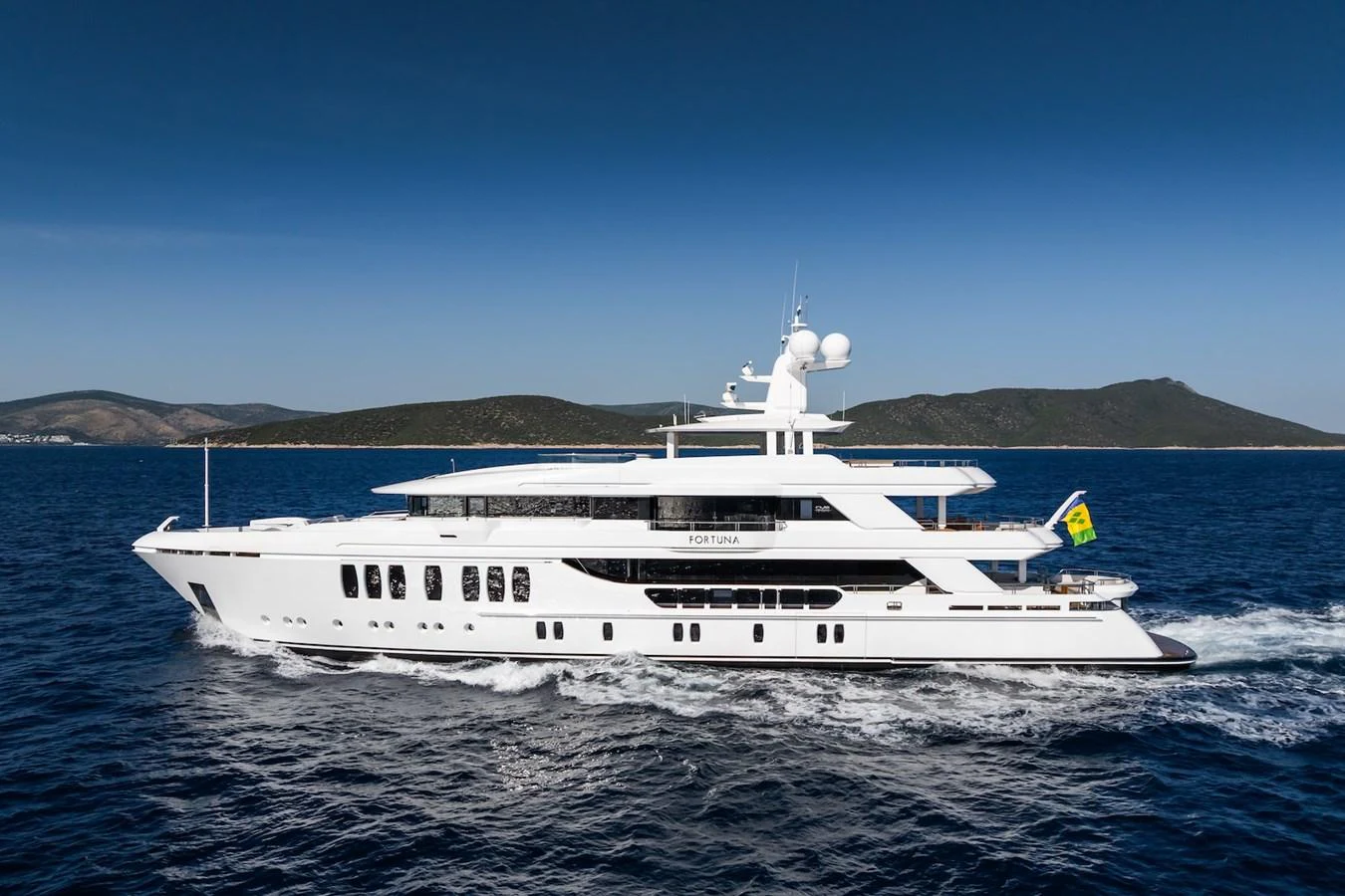 a white yacht on the water aboard FORTUNA Yacht for Sale