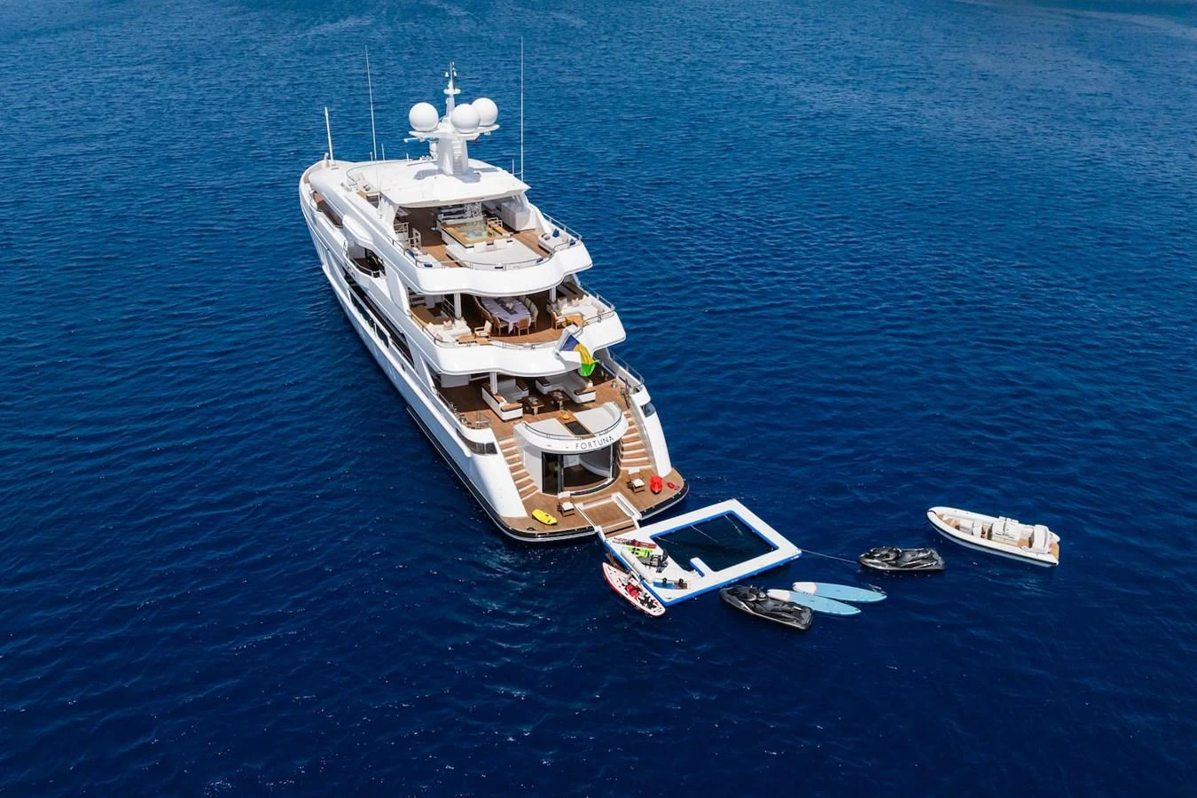 a large ship in the water aboard FORTUNA Yacht for Sale