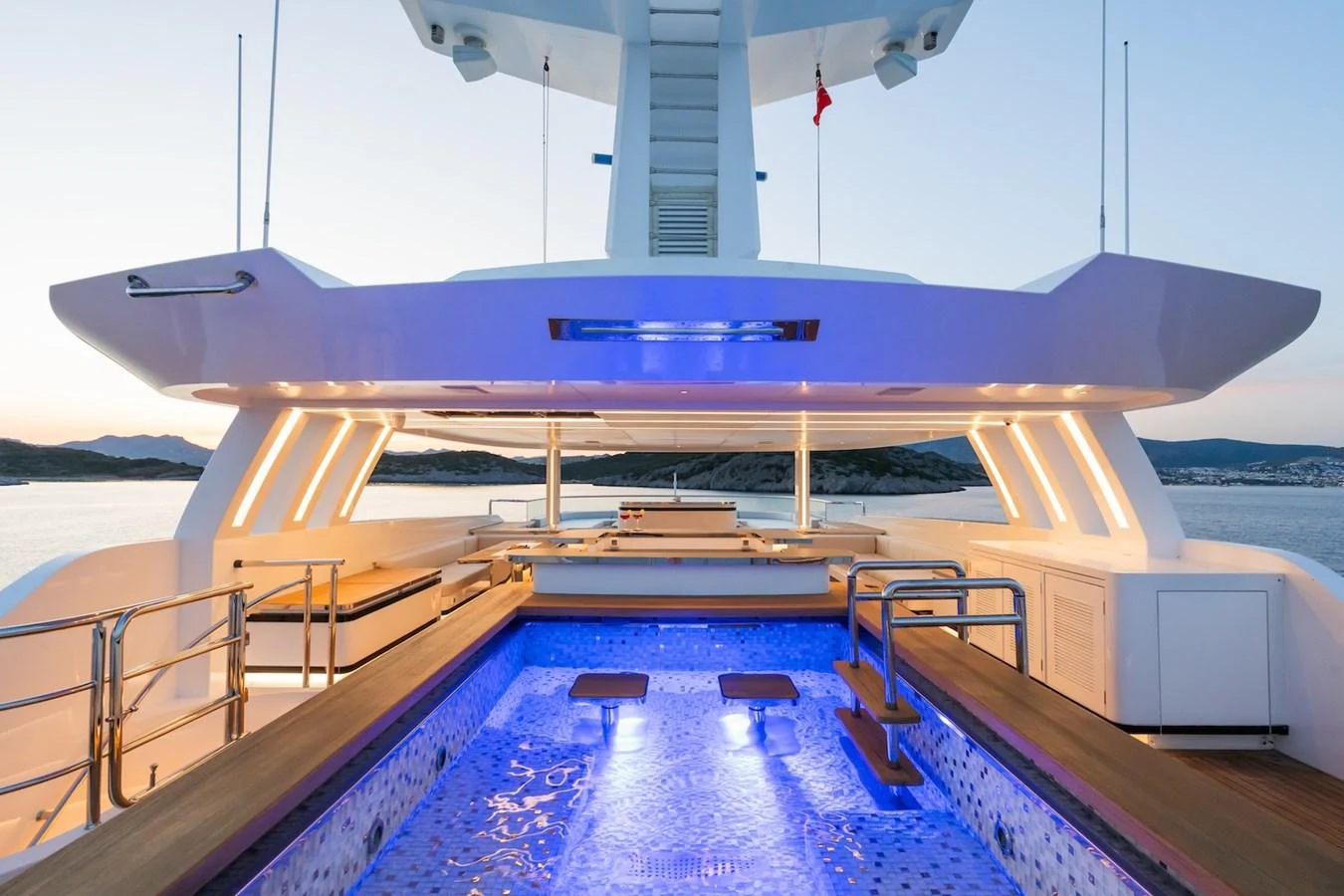 a large ship in the water aboard FORTUNA Yacht for Sale