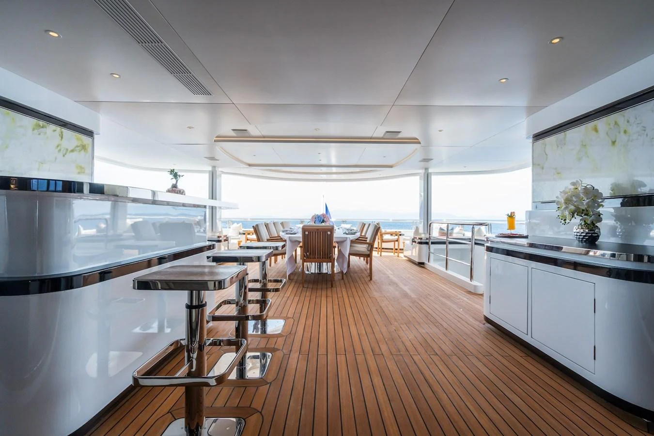 a large kitchen with a wood floor aboard FORTUNA Yacht for Sale