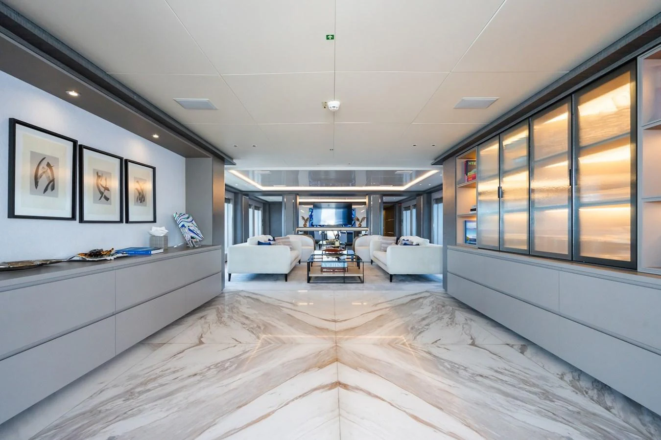 a large room with a wood floor aboard FORTUNA Yacht for Sale