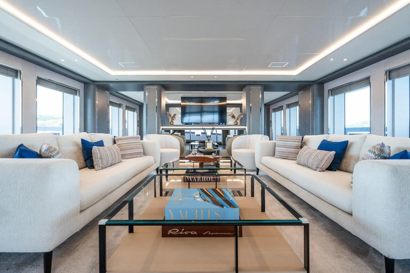a living room with a couch and a coffee table aboard FORTUNA Yacht for Sale