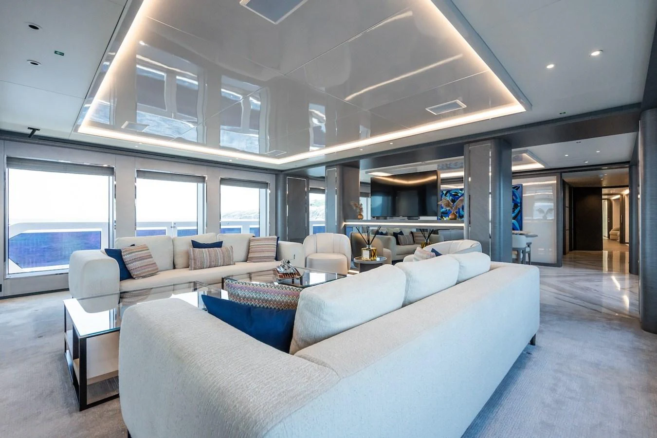 a large living room with a large window aboard FORTUNA Yacht for Sale