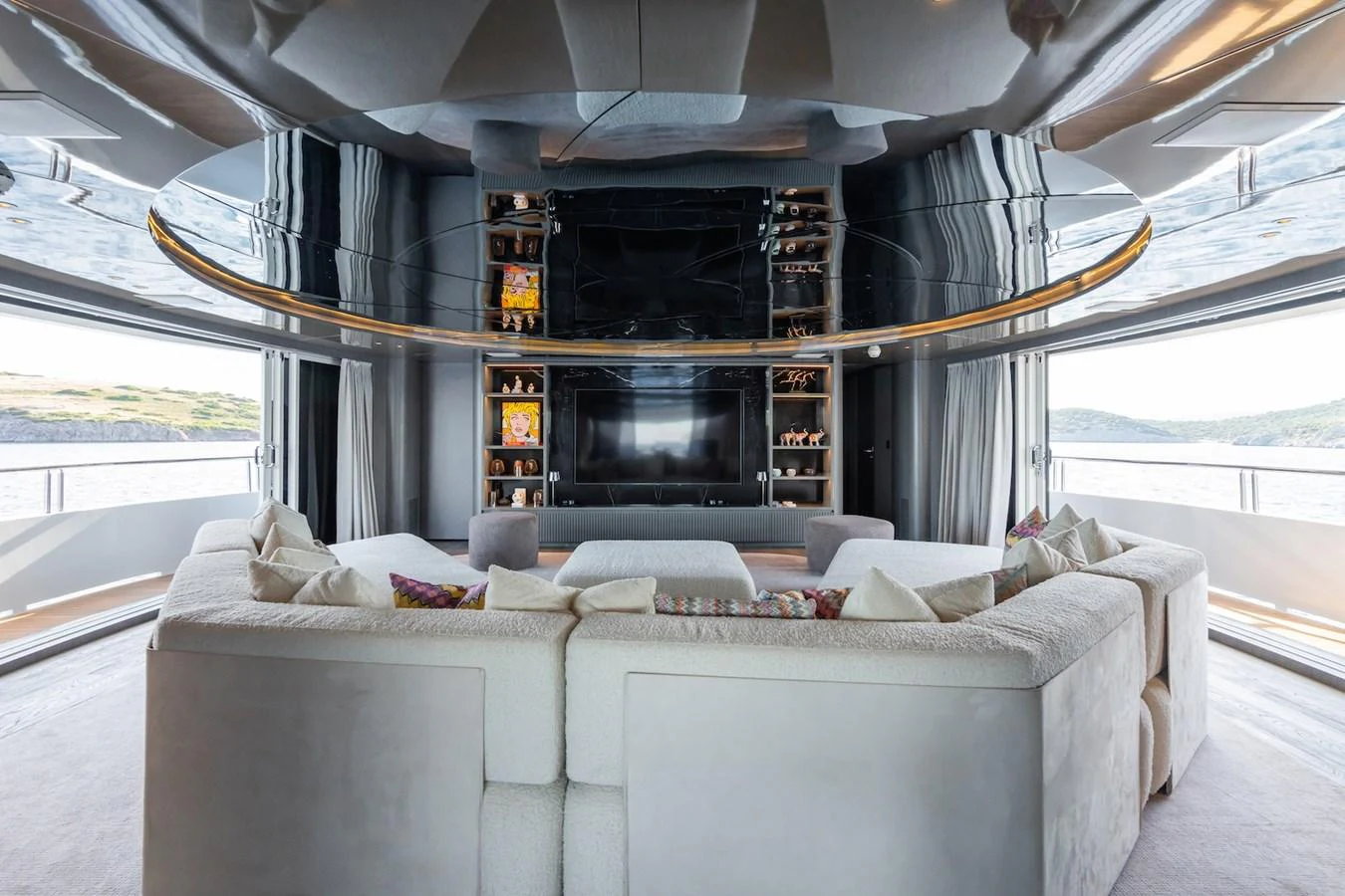 a living room with a fireplace aboard FORTUNA Yacht for Sale