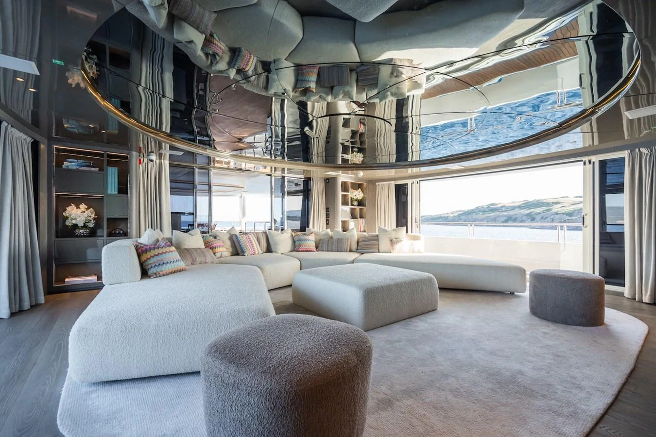 a room with a large window and couches aboard FORTUNA Yacht for Sale