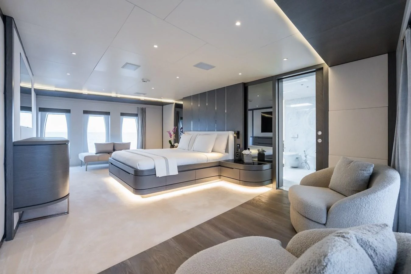 a living room with a large window aboard FORTUNA Yacht for Sale