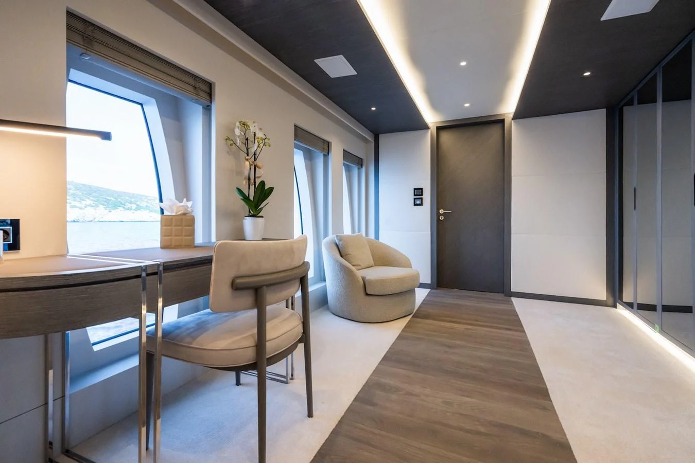 a room with a table and chairs aboard FORTUNA Yacht for Sale