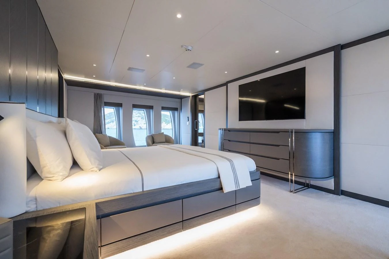 a room with a bed and a television aboard FORTUNA Yacht for Sale