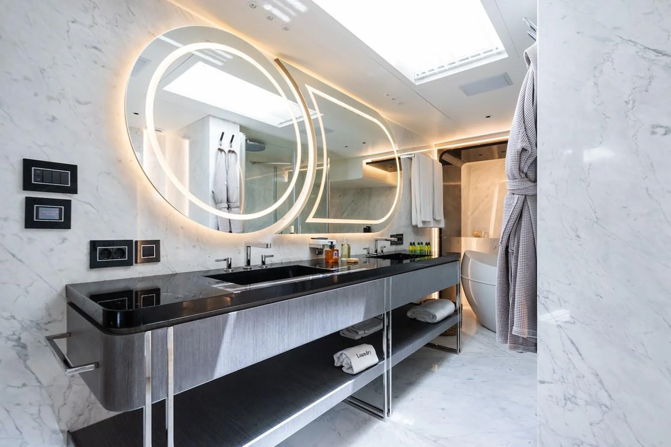 a kitchen with a large round mirror aboard FORTUNA Yacht for Sale