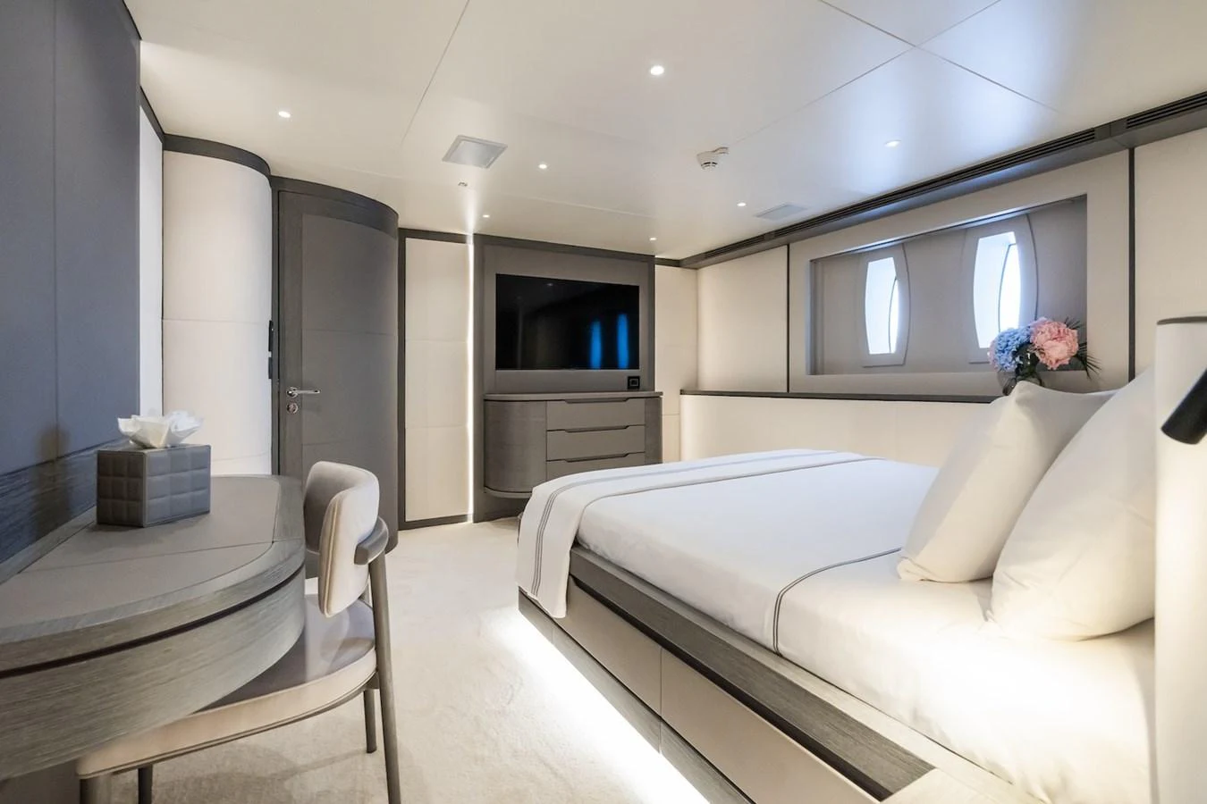 a room with a bed and a television aboard FORTUNA Yacht for Sale