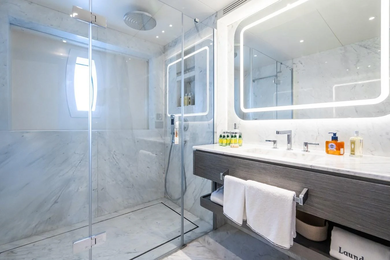 a bathroom with a glass shower aboard FORTUNA Yacht for Sale