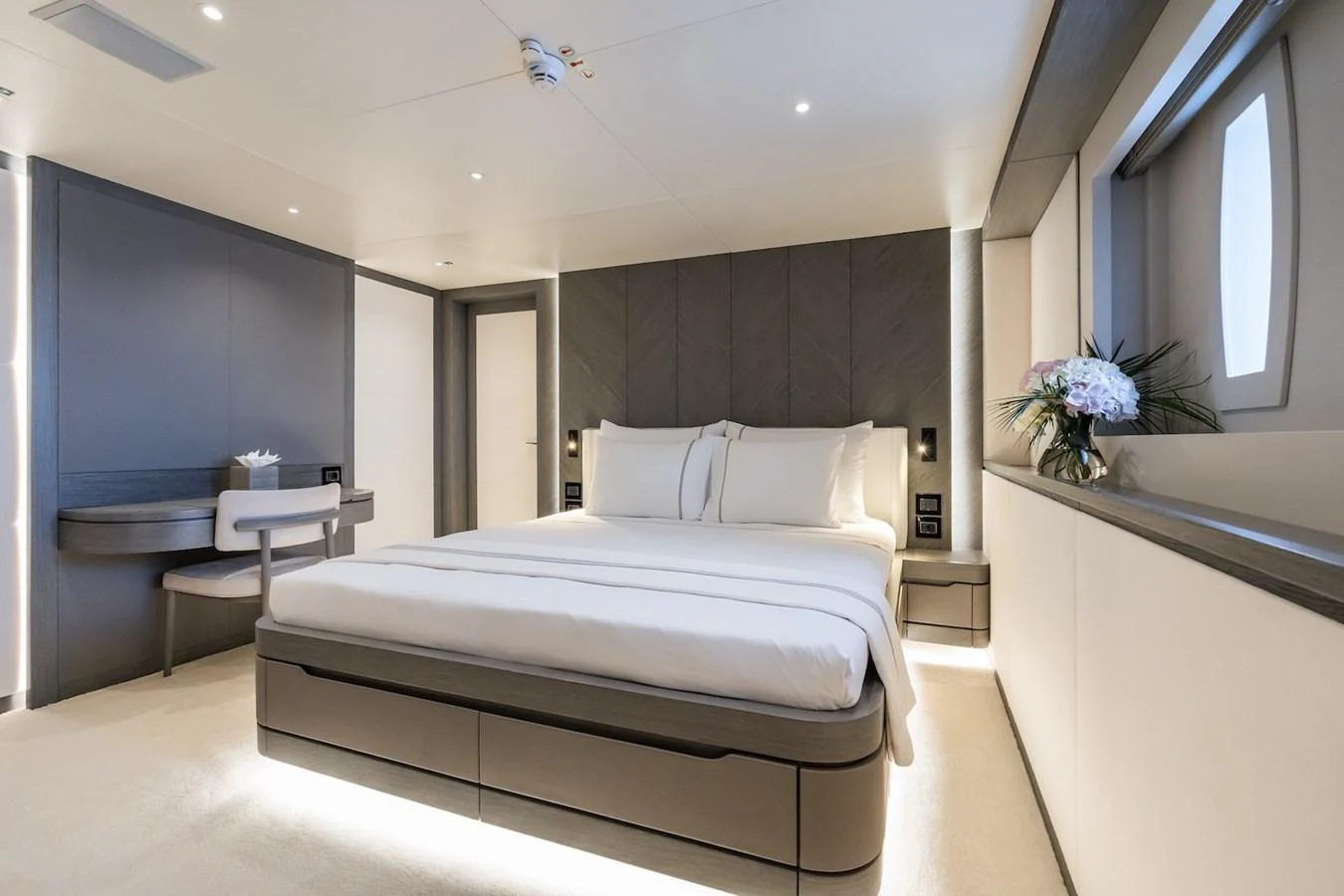 a room with a bed and a window aboard FORTUNA Yacht for Sale
