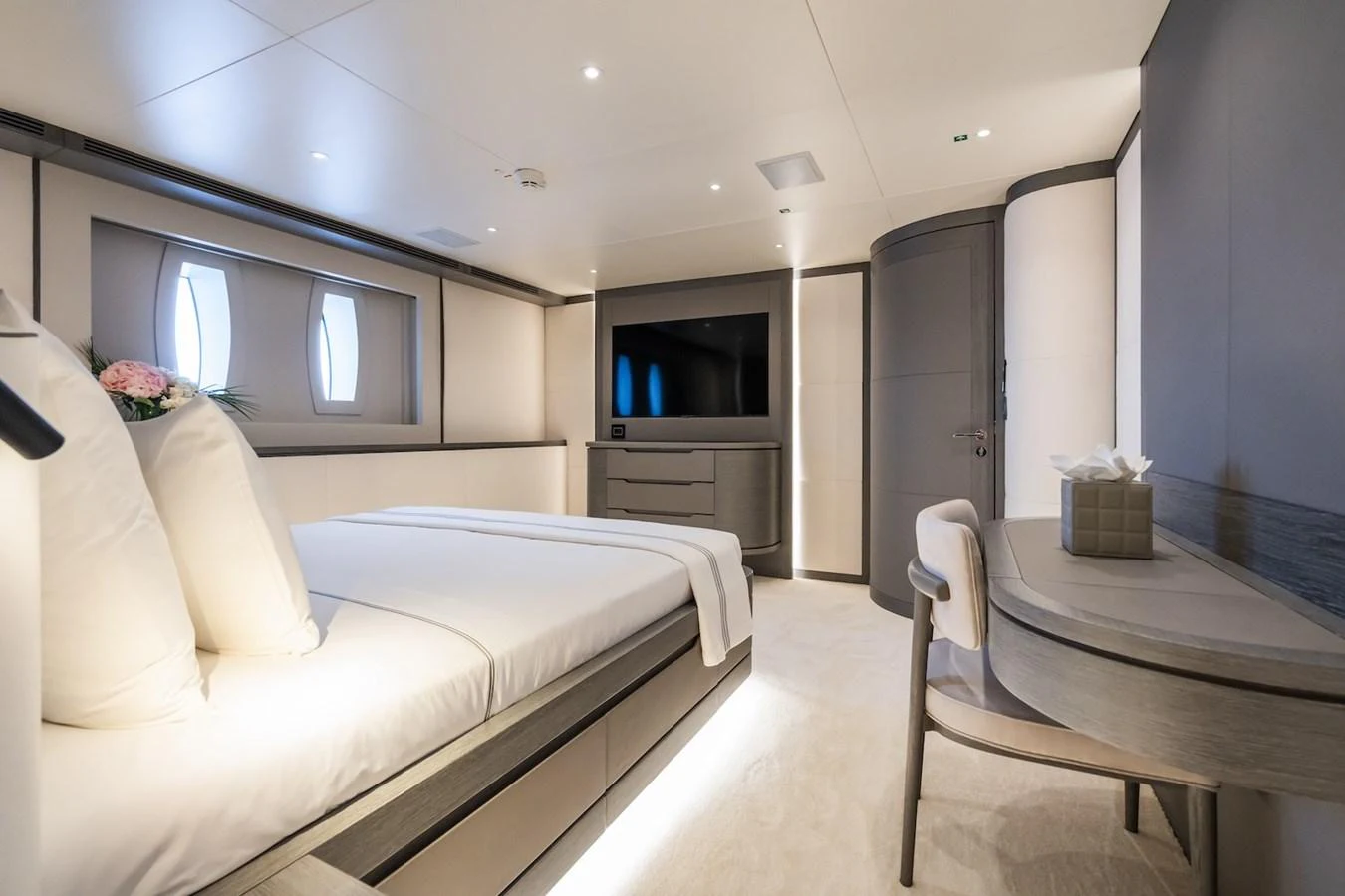 a room with a bed and a television aboard FORTUNA Yacht for Sale