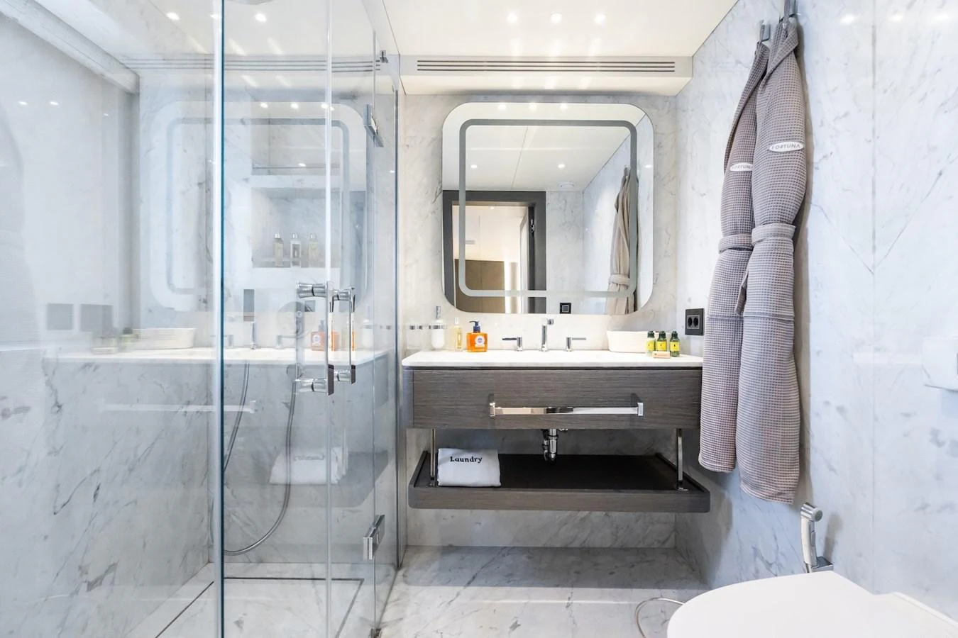 a bathroom with a glass shower aboard FORTUNA Yacht for Sale