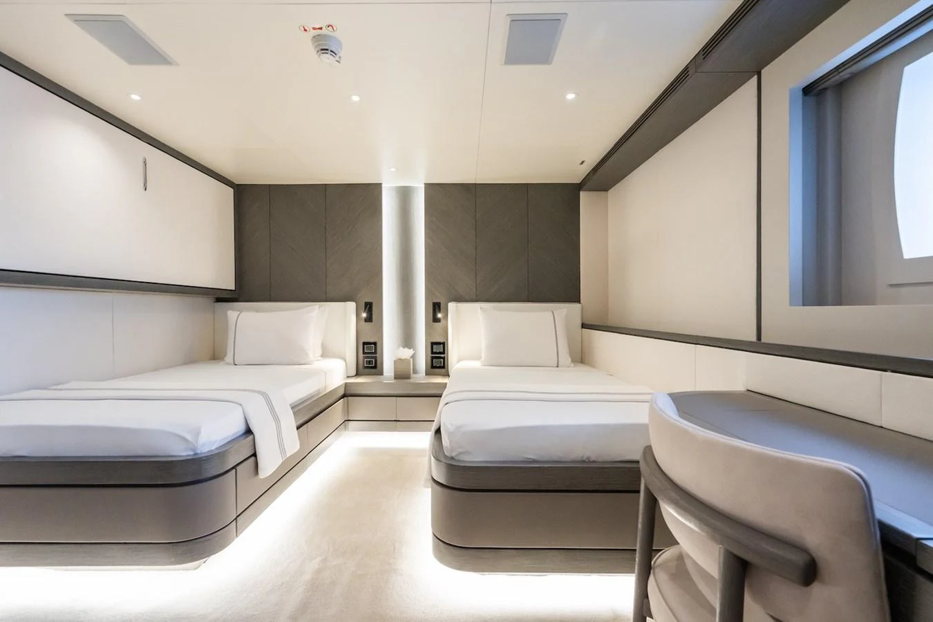 a room with a bed and a chair aboard FORTUNA Yacht for Sale
