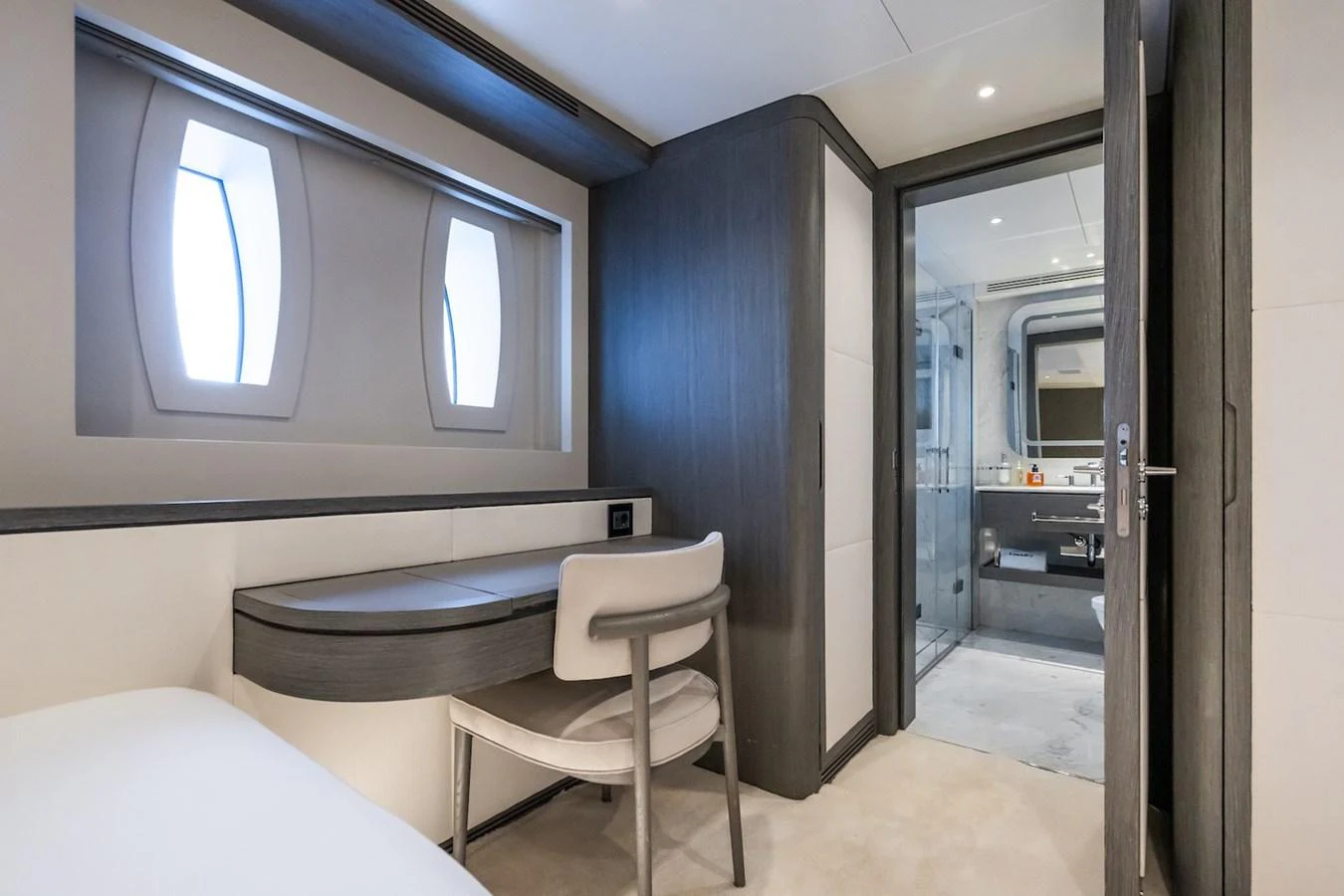 a room with a bed and a chair aboard FORTUNA Yacht for Sale