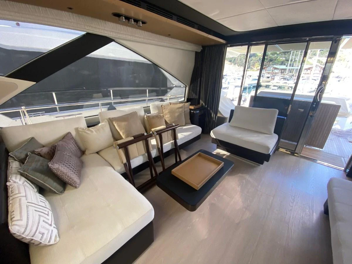 a room with a couch and a table and chairs aboard 10009846 Yacht for Sale