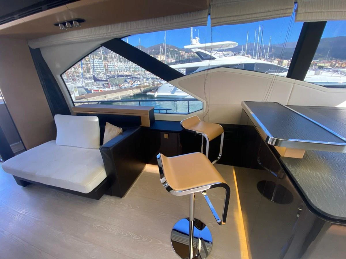 a room with a couch and a table and chairs aboard 10009846 Yacht for Sale