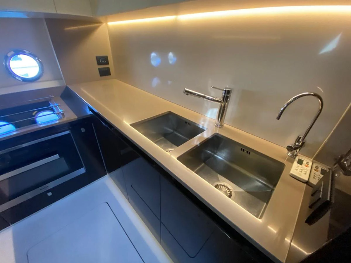 a kitchen with a sink and a faucet aboard 10009846 Yacht for Sale